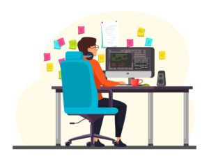 Guy setting at his desk, Infront of laptop